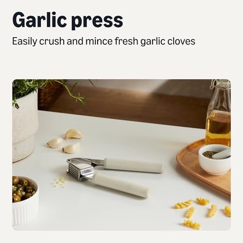 Amazon Basics Garlic Press, Stainless Steel Garlic Mincer & Crusher with Soft-Grip Handle, Dishwasher-Safe, Linen Gray