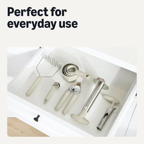 Amazon Basics Garlic Press, Stainless Steel Garlic Mincer & Crusher with Soft-Grip Handle, Dishwasher-Safe, Linen Gray